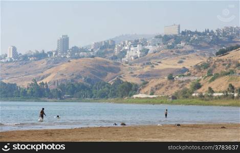 The shore of lake Kinneret near the town of Tiberias in the summer in the morning