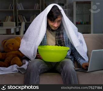 The sick man doing inhalation at night in home. Sick man doing inhalation at night in home
