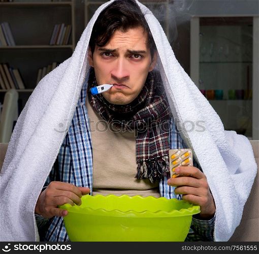 The sick man doing inhalation at night in home. Sick man doing inhalation at night in home