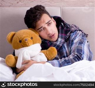 The sick man suffering from flu in the bed. Sick man suffering from flu in the bed