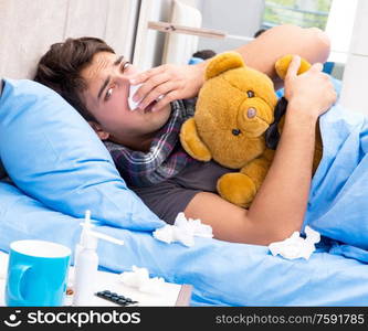 The sick man with flu lying in the bed. Sick man with flu lying in the bed