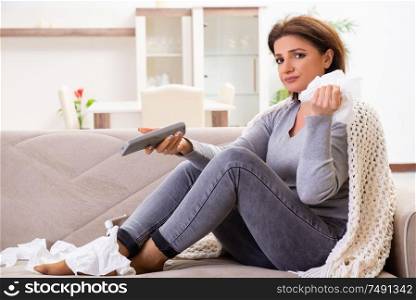 The sick middle-aged woman suffering at home. Sick middle-aged woman suffering at home