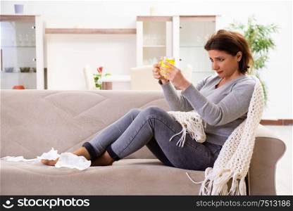 The sick middle-aged woman suffering at home. Sick middle-aged woman suffering at home