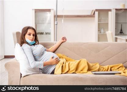 The sick pregnant woman suffering at home. Sick pregnant woman suffering at home
