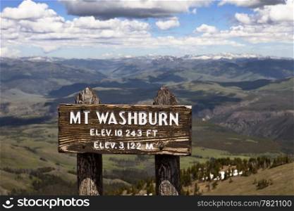 The sign at the summit of Mt. Washburn which, at an elevation of 10,243 feet, is the highest point in Yellowstone National Park.