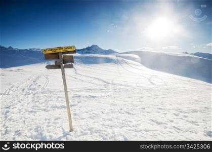 The signpost in the snowy mountains scenery