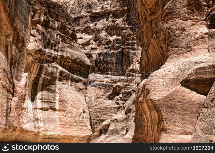 The Siq, the narrow slot-canyon that serves as the entrance passage to the hidden city of Petra, Jordan,