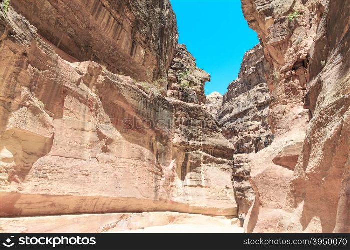 The Siq, the narrow slot-canyon that serves as the entrance passage to the hidden city of Petra, Jordan,&#xA;&#xA;