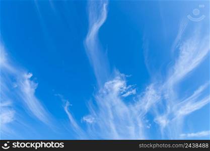 The sky is blue with clouds in beautiful, strangely patterned lines.