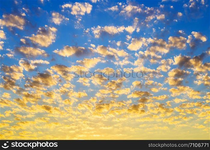 The sky is filled with clouds during sunrise.