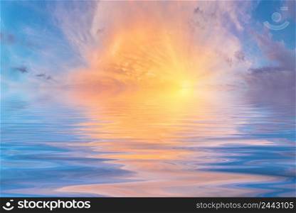 The sky with a bright sun reflected in the water. Sky with a bright sun reflected in the water