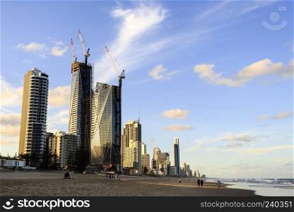 The skyscrapers of the Gold Coast seen from the beach at Broadbeach before sunset.