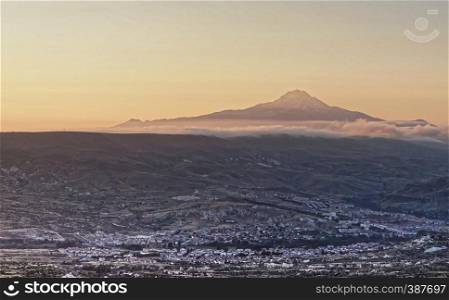 The sleeping giant, view of the volcano Erciyes near Kayseri in Anatolia, Turkey, with the villages of Cappadocia in the foreground, aerial view from the hot-air balloon.