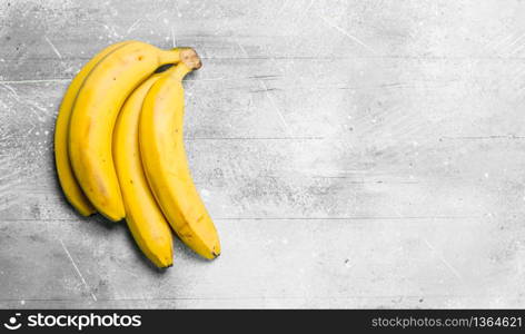 The smell of fresh bananas. On white rustic background.. The smell of fresh bananas.