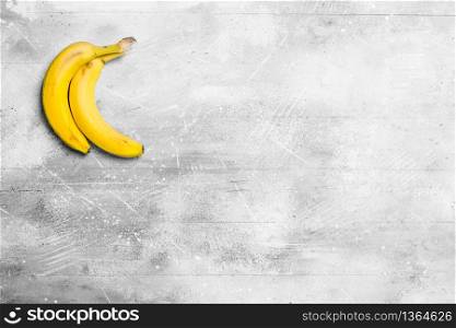 The smell of fresh bananas. On white rustic background.. The smell of fresh bananas.