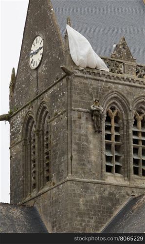The soldier landed on the steeple of the church of Sainte Mere Eglise
