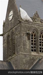 The soldier landed on the steeple of the church of Sainte Mere Eglise