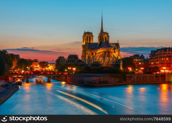 The southern facade of Cathedral of Notre Dame de Paris at sunset