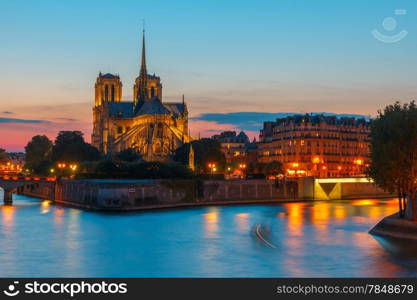 The southern facade of Cathedral of Notre Dame de Paris at sunset