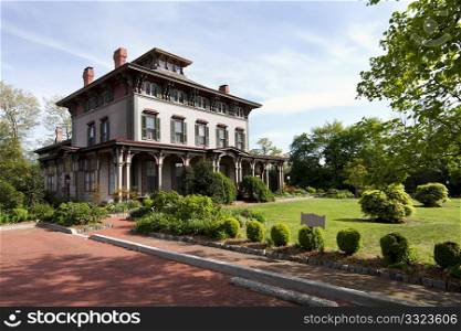 The Southern Mansion in Cape May, NJ, built with historic Victorian architecture, with garden yard.