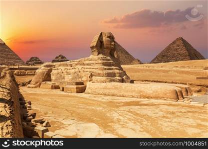 The Sphinx and the Pyramids, beautiful close sunset view, Egypt.. The Sphinx and the Pyramids, beautiful close sunset view, Egypt