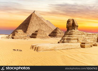 The Sphinx and the Pyramids of Giza, wonders of the world in Egypt, sunset view.. The Sphinx and the Pyramids of Giza, wonders of the world in Egypt, sunset view