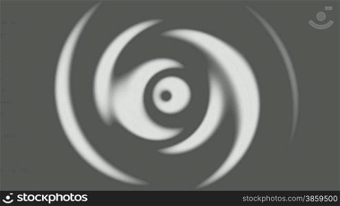 The spiral rotates on a gray background