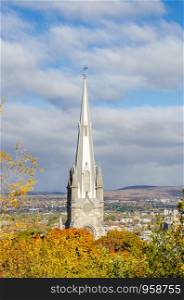 The spire of Chalmers-Wesley United Church in Upper Town of Old Quebec City during autumn season, Canada