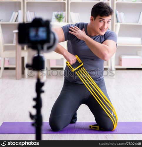 The sports and health blogger recording video in sport concept. Sports and health blogger recording video in sport concept