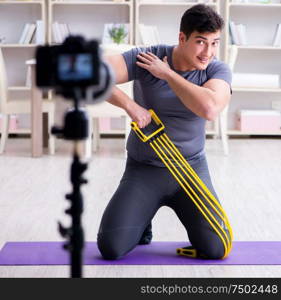 The sports and health blogger recording video in sport concept. Sports and health blogger recording video in sport concept