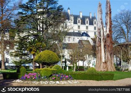 The spring lovely public park in Loches town (France) and castle (build in 9th century) behind.