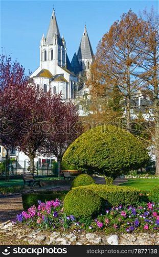 The spring lovely public park in Loches town (France) and St.Oars church behind (dates from 10-12 century)