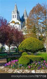 The spring lovely public park in Loches town (France) and St.Oars church behind (dates from 10-12 century)