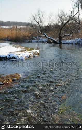 The spring river. A rough stream after a spring thawing weather