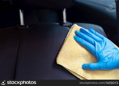 The staff is cleaning the car With antiseptics, the Covid 19 virus or the Corona virus