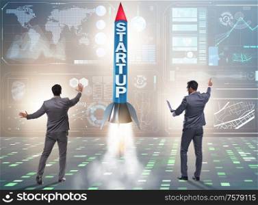 The start-up concept with rocket and businessman. Start-up concept with rocket and businessman