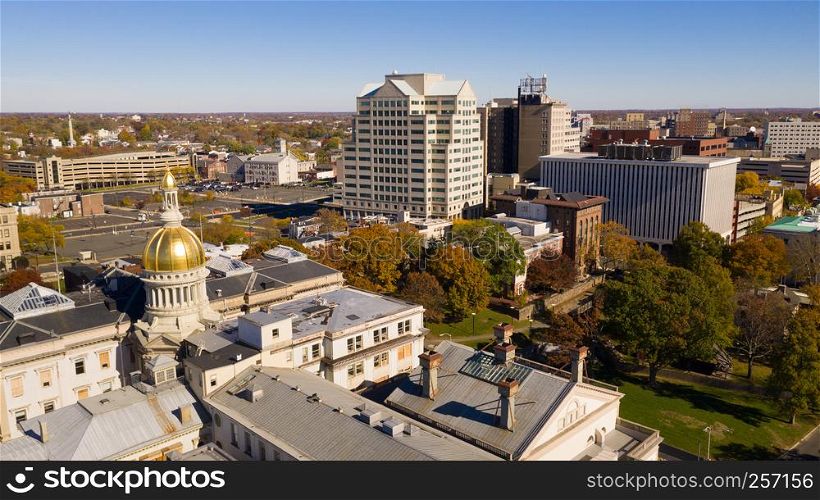 The state capital dome reflects sunlight late afternoon in downtown Trenton New Jersey