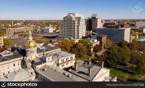 The state capital dome reflects sunlight late afternoon in downtown Trenton New Jersey