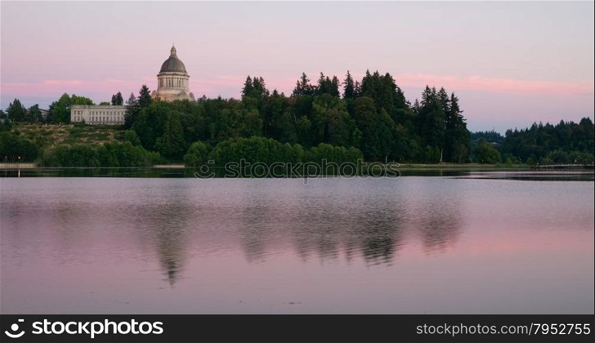 The state capital reflects in the lake of the same name at dusk in Olympia, Wa