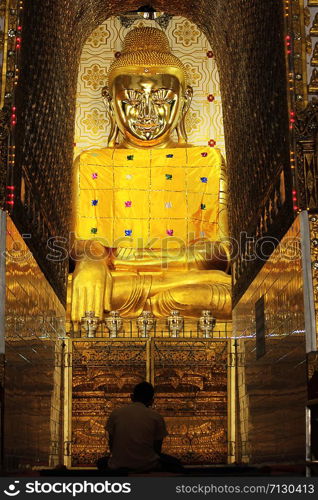 The statue in the temple is gold