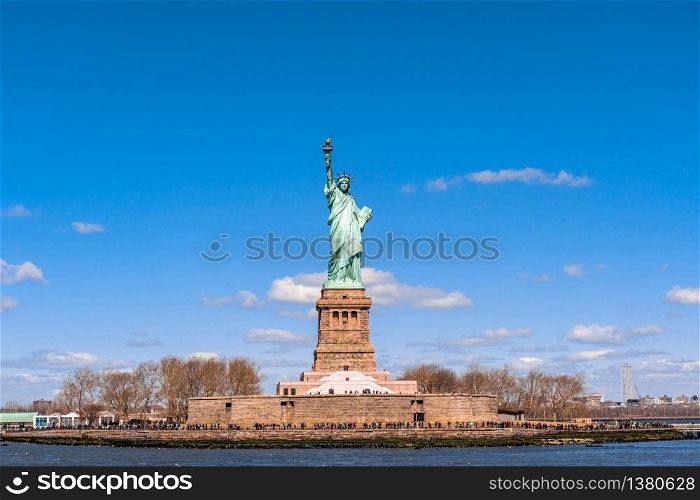 The Statue of Liberty under the blue sky background, Lower Manhattan, New York City, United state of America, Architecture and building with tourist concept