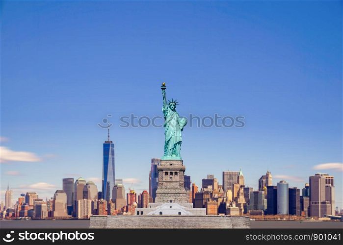 The Statue of Liberty with the One world Trade building center over hudson river and New York cityscape background, Landmarks of lower manhattan New York city.