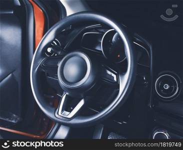 The steering wheel in the car driver cockpit of modern car