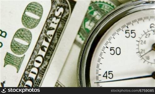 The stopwatch on the dollar cash