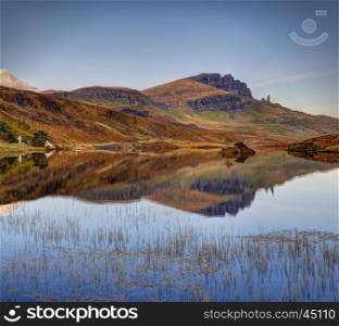 The Storr reflection in Loch Leathan, Isle of Skye, Highland, Scotland. Quiet october morning.