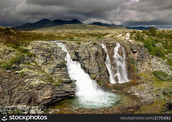 The Storulfossen or Brudesloret waterfall near Mysuseter in the Norwegian National Park Rondane. The Storulfossen waterfall in Rondane National Park