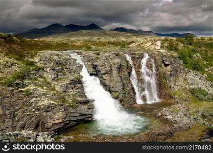 The Storulfossen or Brudesloret waterfall near Mysuseter in the Norwegian National Park Rondane. The Storulfossen waterfall in Rondane National Park