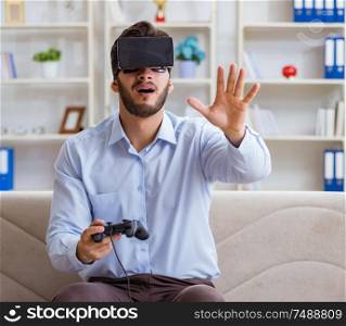 The student gamer playing games at home. Student gamer playing games at home