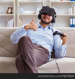 The student gamer playing games at home. Student gamer playing games at home