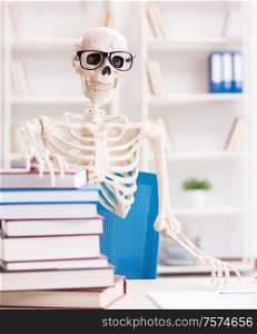 The student skeleton preparing for exams. Student skeleton preparing for exams